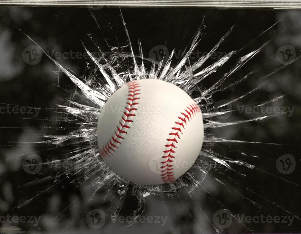 Baseball through broken window photo