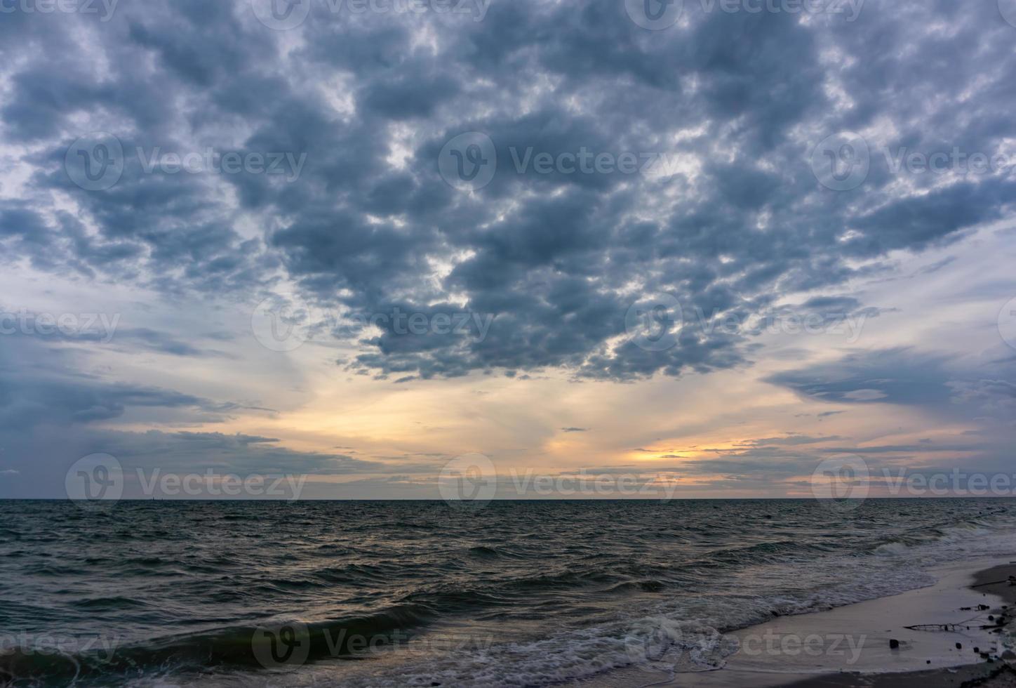 The evening sky has clouds full of sky, the light from the sun reflect Seawater, sea surface photo