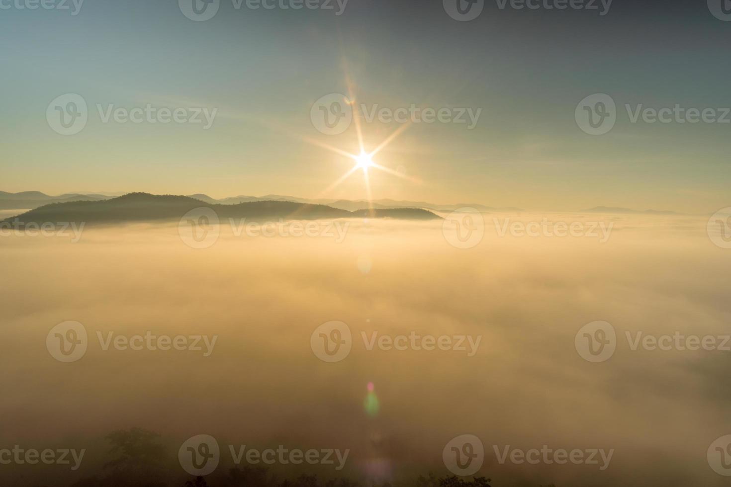 Morning fog covers Lamphun, Thailand, view from the viewpoint of Wat Phra That Pha Temple photo