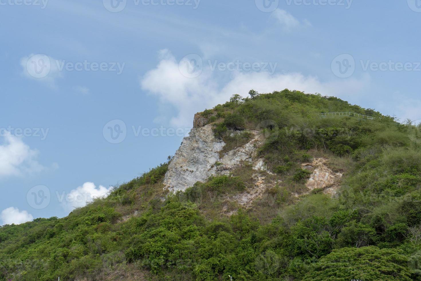 Green peak Cut against the blue sky photo