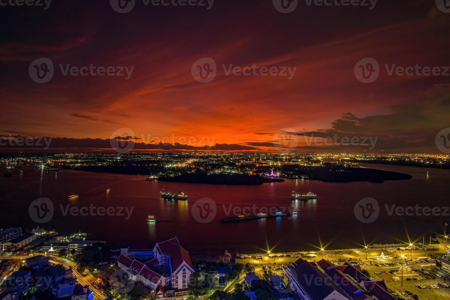 Bird's eye view of Samut Prakan, Thailand. Sunset over the Chao Phraya River, orange sky. photo