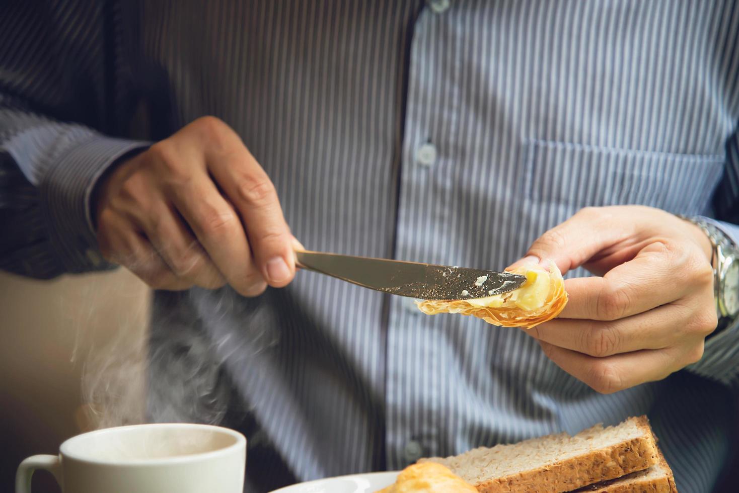 Business man eat the American breakfast set in a hotel - people take a breakfast in hotel concept photo