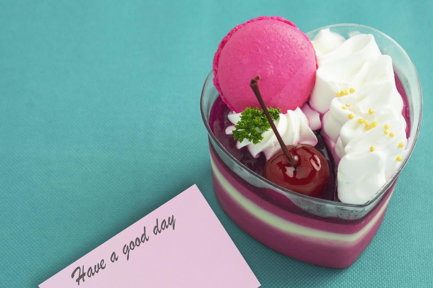 Colorful strawberry cake and macaron on colorful bright background and lovely card - love with cake and ecard concept photo