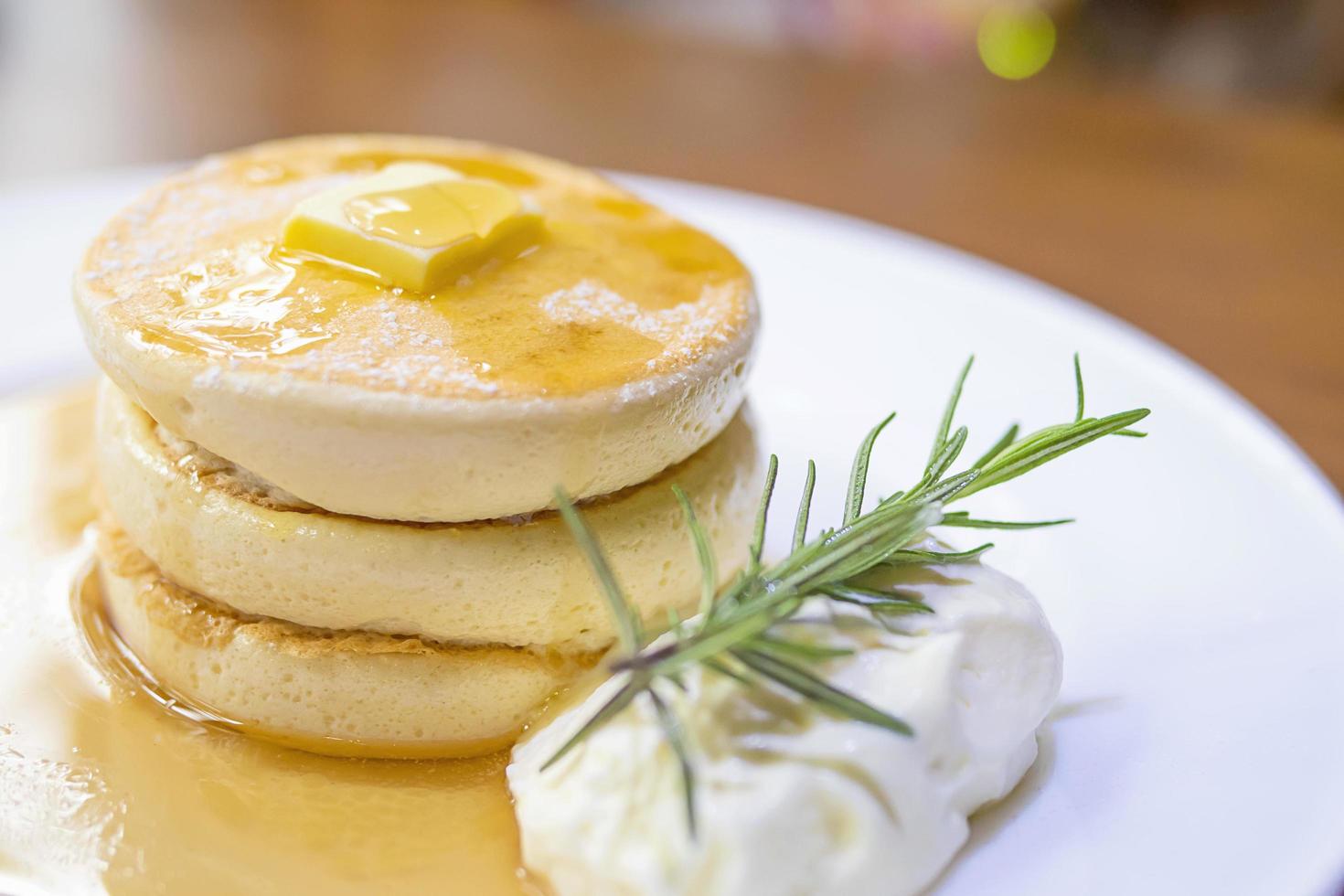 pancake with melted butter and syrup on top photo