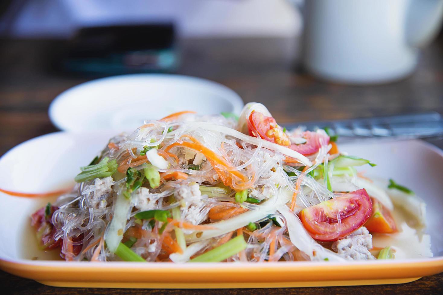 Traditional Thai food called Glass Noodle Pork Nut Spicy Salad photo