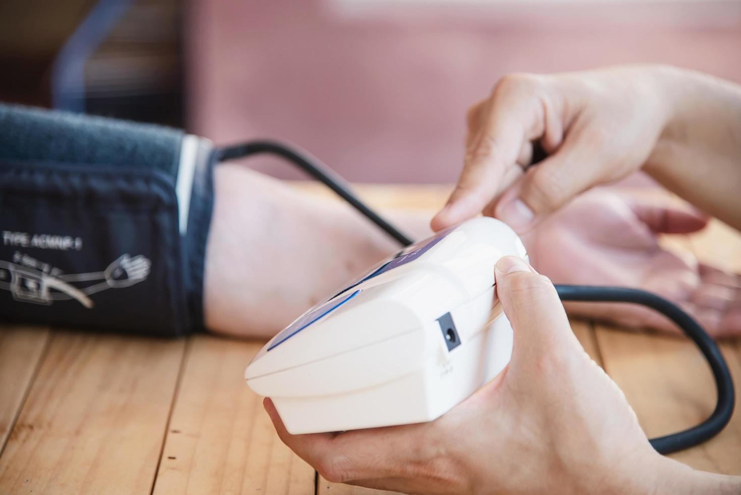 Old lady is being checked blood pressure using blood pressure monitor kid set - people with health care medical instrument set concept photo