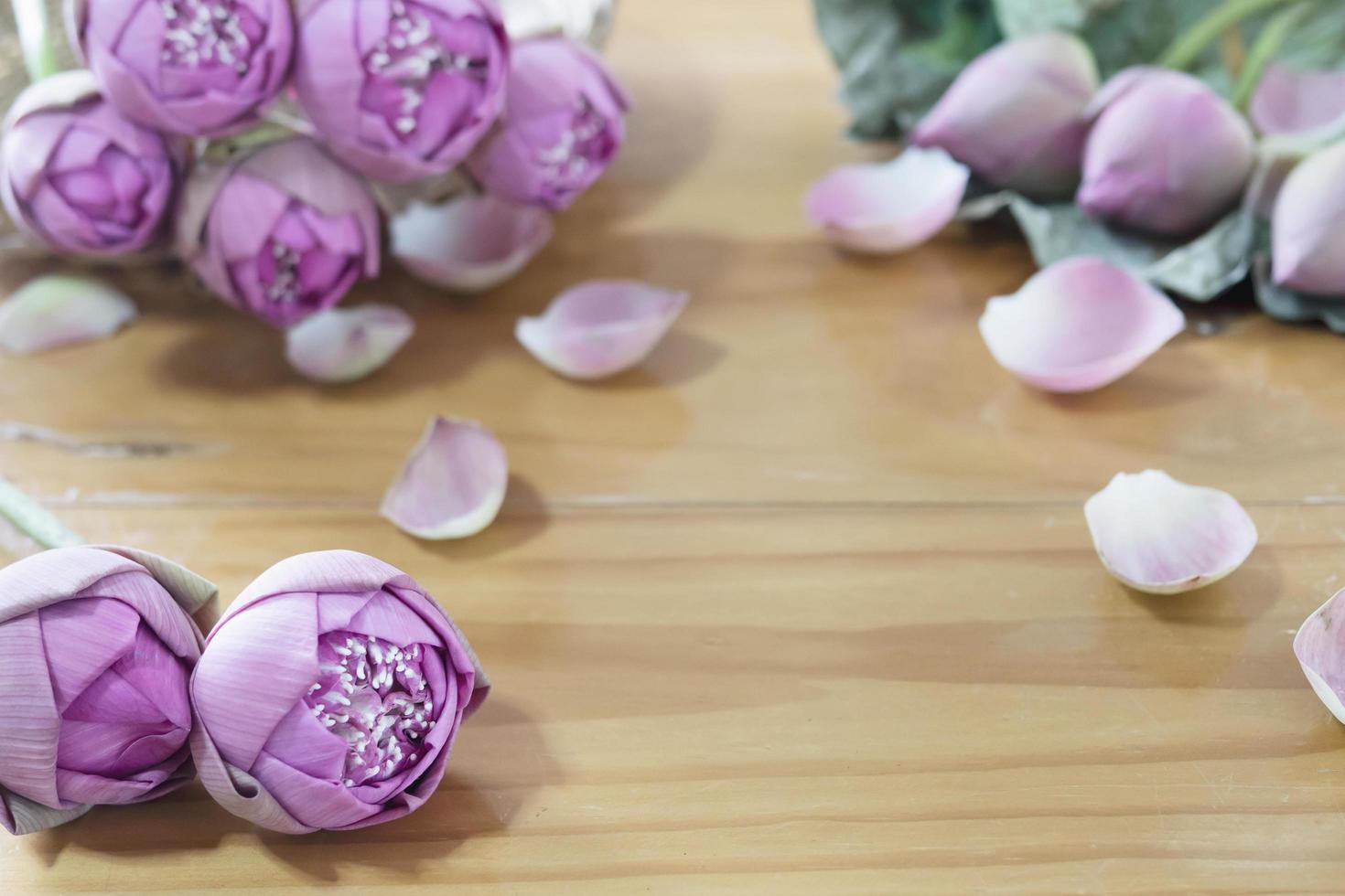 Folded pink lotus on wooden table - handicraft flower concept photo