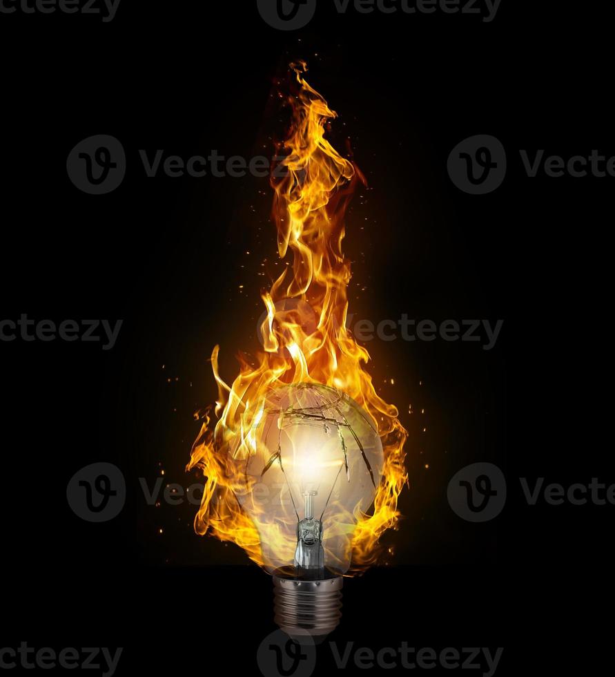 broken light bulb with flame on black background. 3d render photo