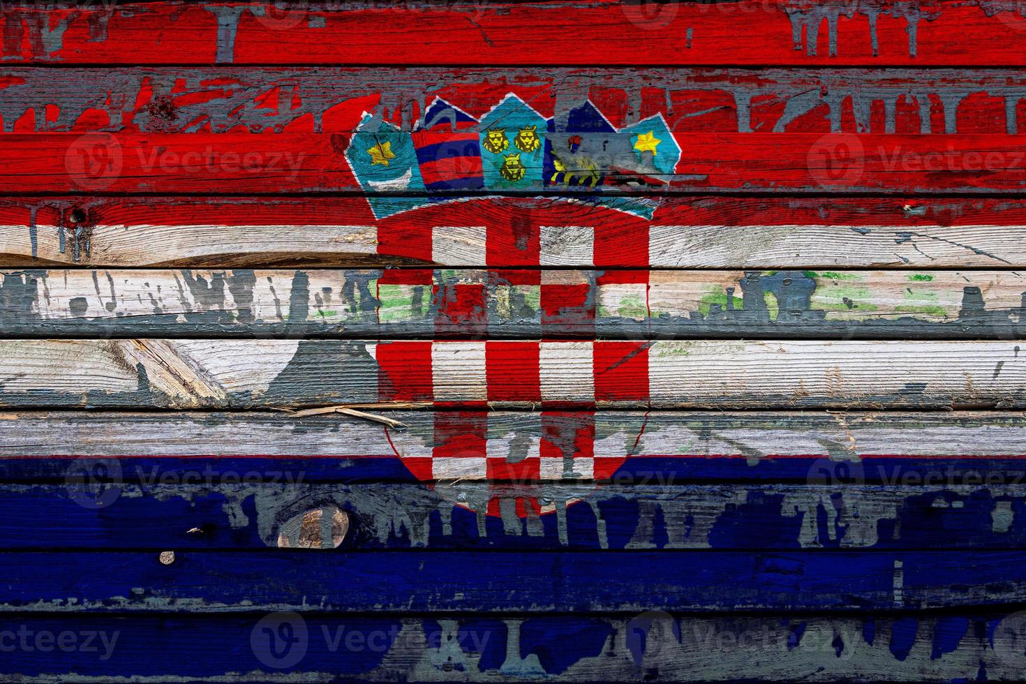 The national flag of Croatia is painted on uneven boards. Country symbol. photo
