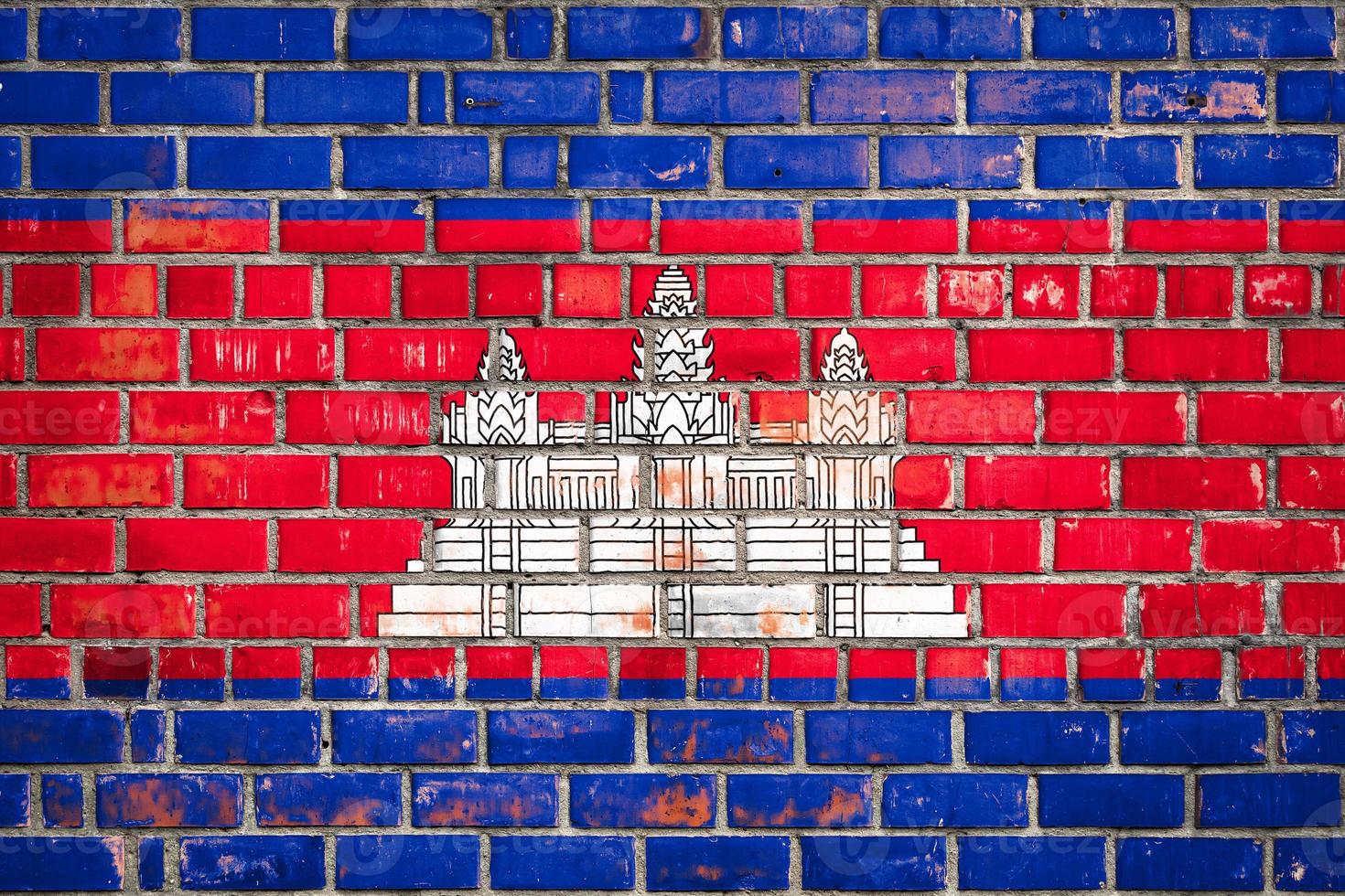 National  flag of the Cambodia  on a grunge brick background. photo