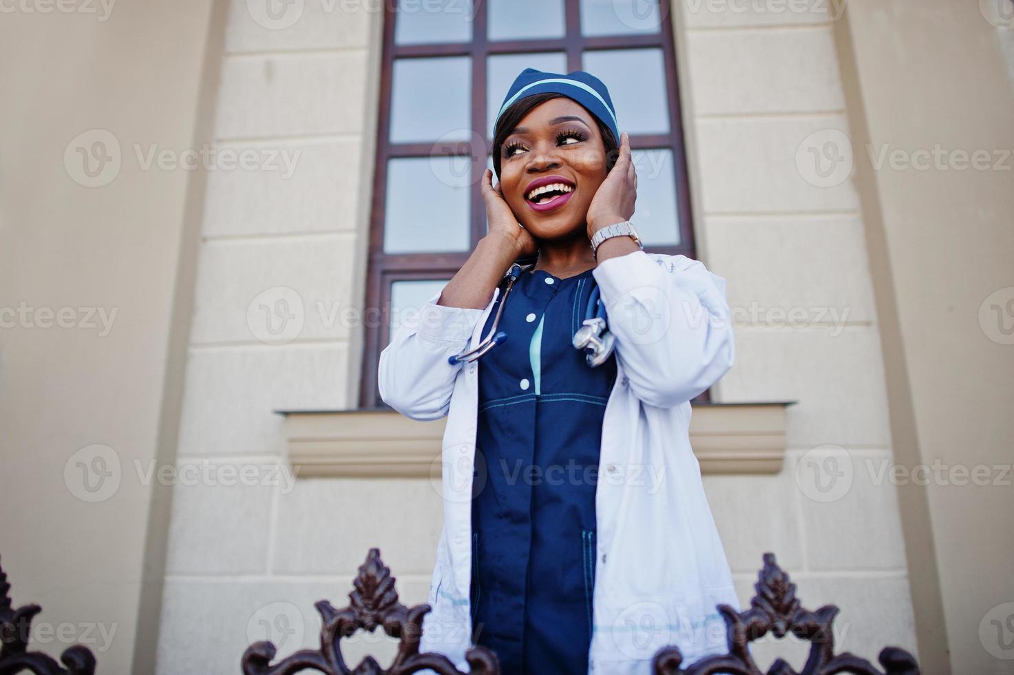 African american doctor female with stethoscope posed outdoor. photo