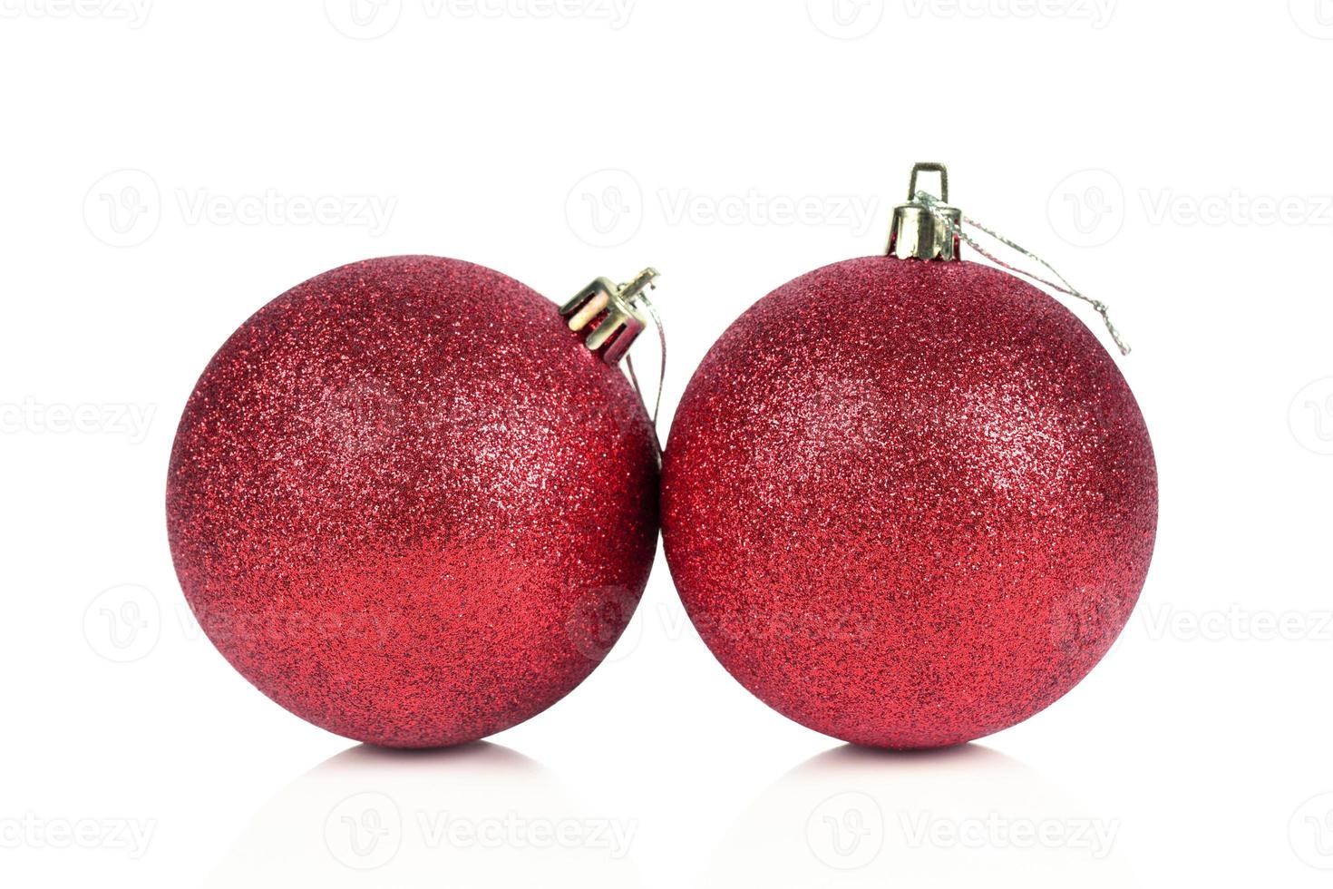 Red Christmas balls isolated over white background photo