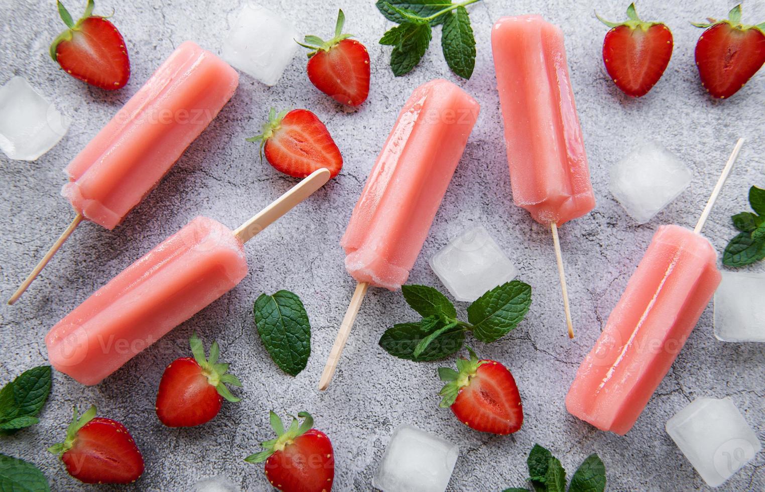 Strawberry ice cream popsicles photo