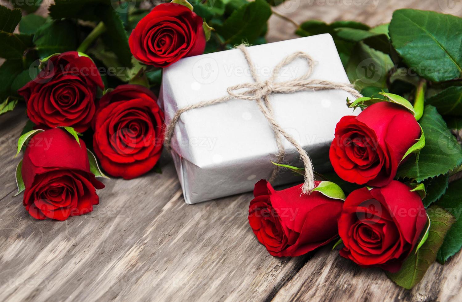 Red roses and gift box photo
