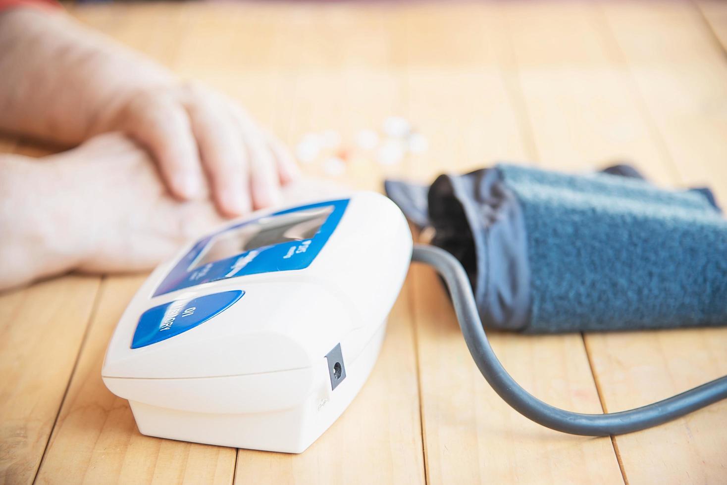 Old lady is being checked blood pressure using blood pressure monitor kid set - people with health care medical instrument set concept photo
