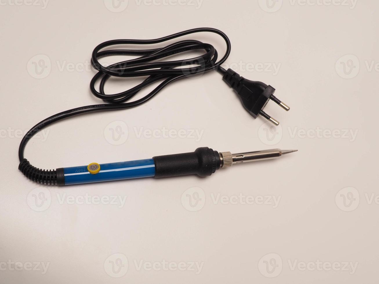 Close up shoot of soldering iron, a tool for soldering electrical components photo