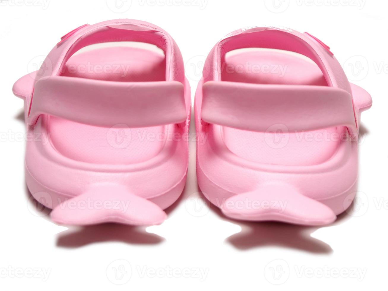 Picture of pink sendals that has shark shape photo
