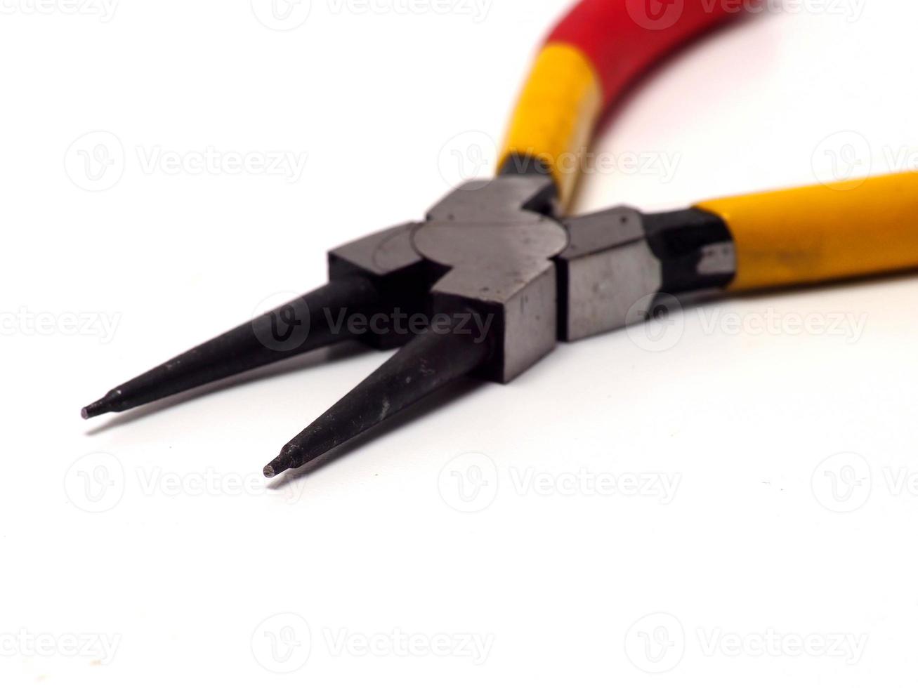 Picture of snap ring plier that has a yellow - red handle photo