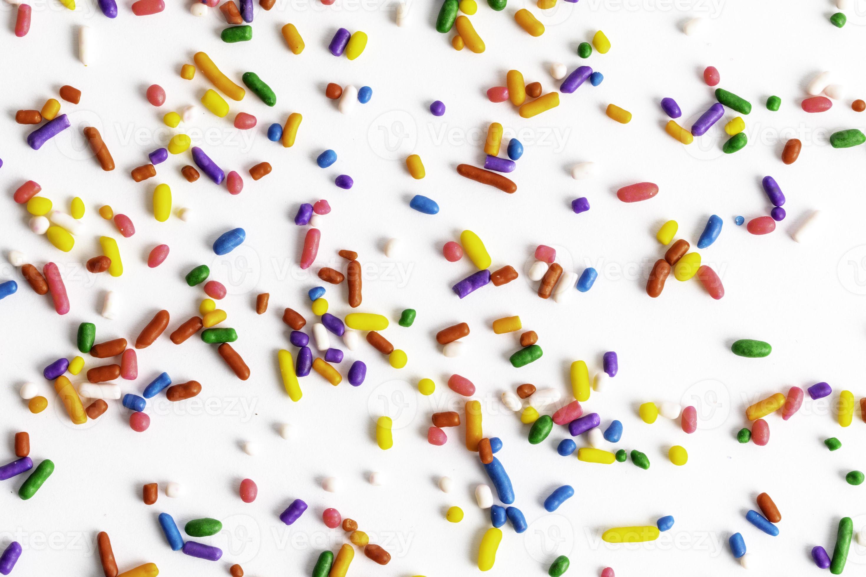 Rainbow Sprinkles on White Background 10193651 Stock Photo at Vecteezy