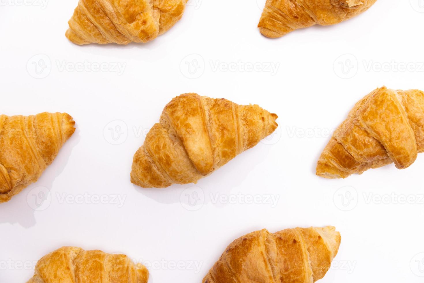 Croissants Patterned On White Surface photo