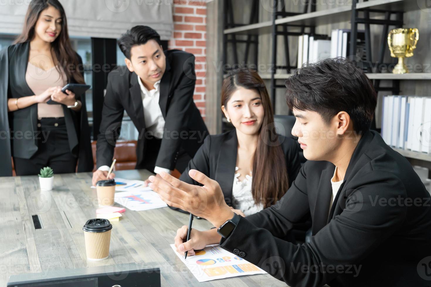 Happy group of businesspeople during presentation. Business people working as a team at the office photo