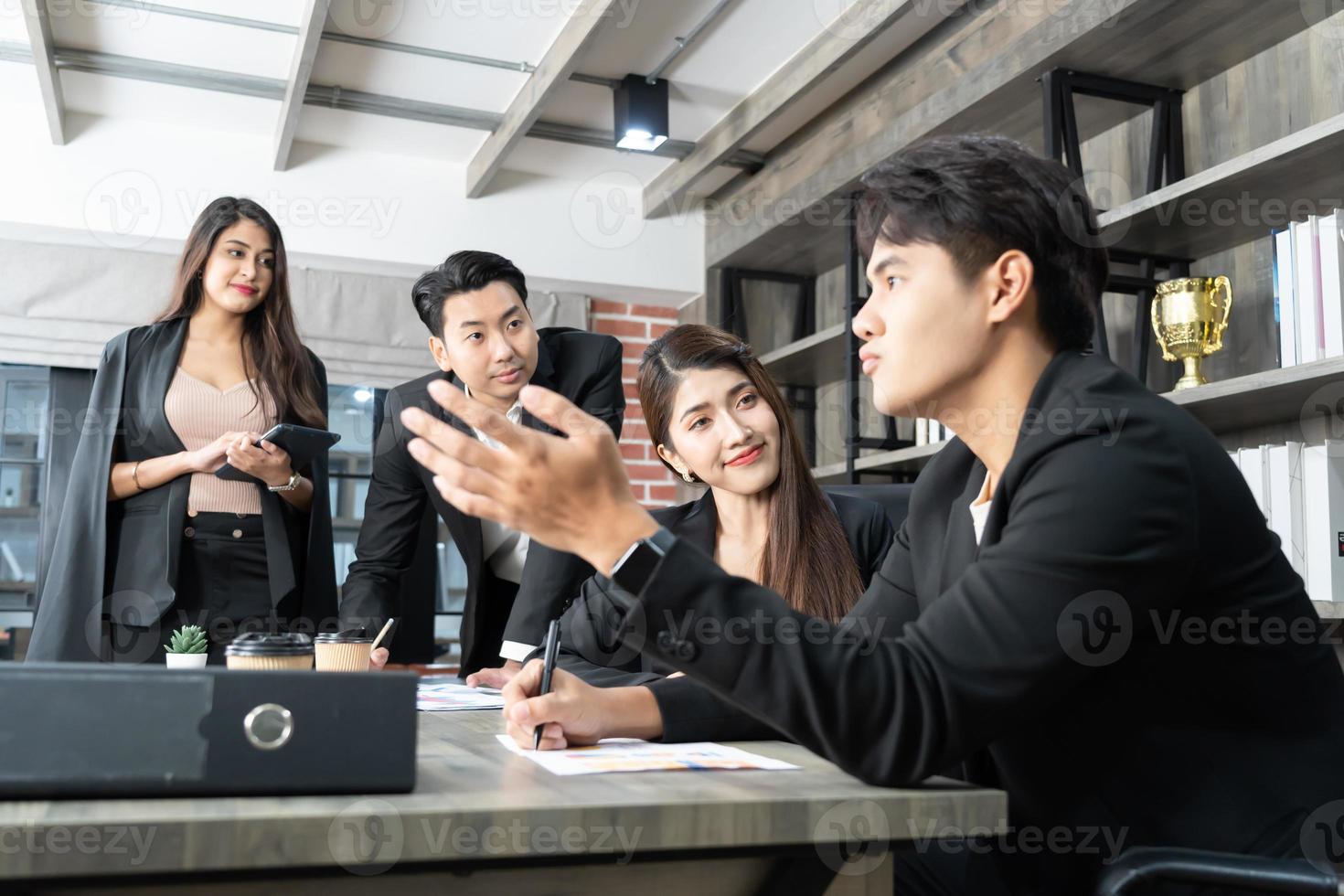 Happy group of businesspeople during presentation. Business people working as a team at the office photo