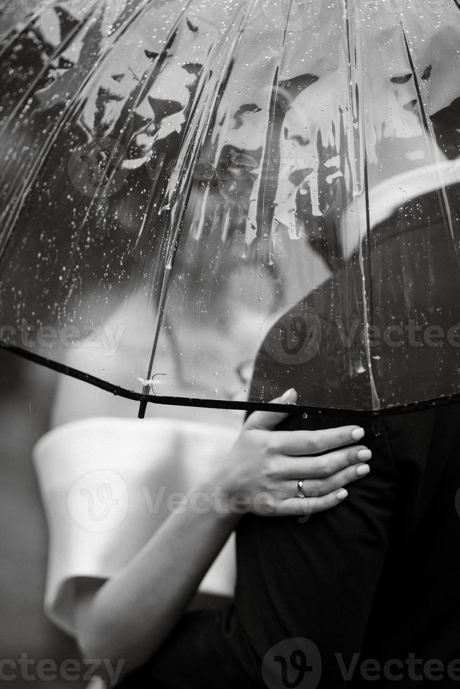 young couple bride and groom in a white short dress photo