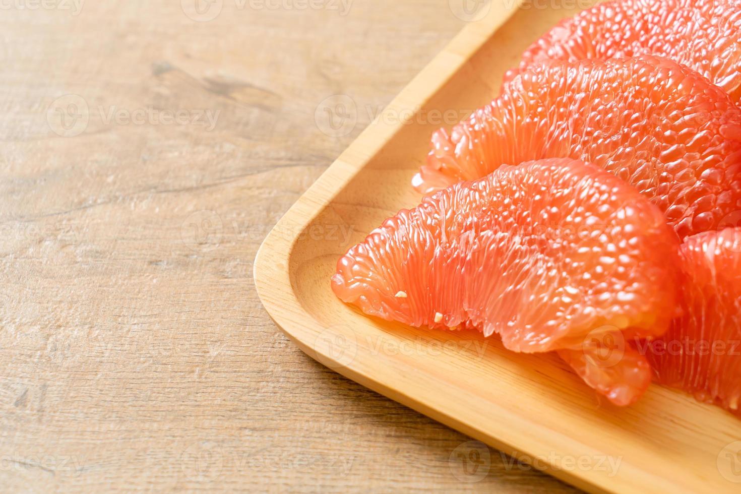 fresh red pomelo fruit or grapefruit photo