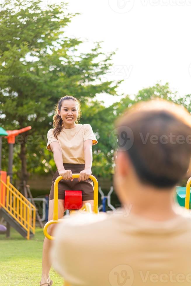 Asian couple love play seesaw photo