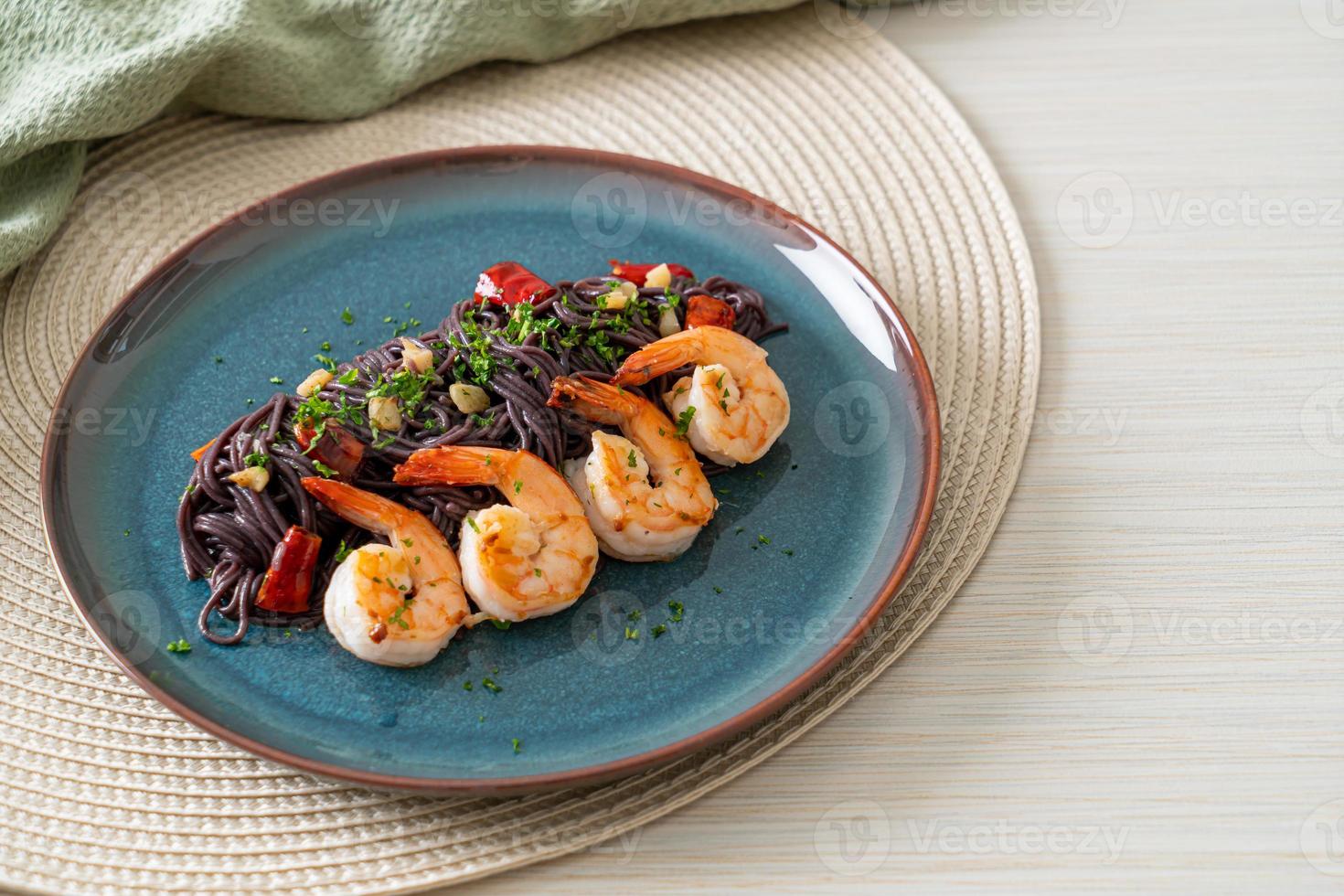 stir-fried black spaghetti with garlic and shrimps photo