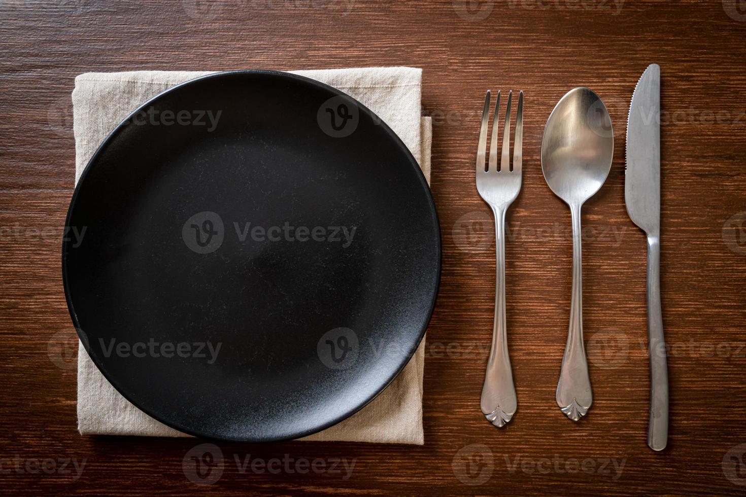 empty plate or dish with knife, fork and spoon photo