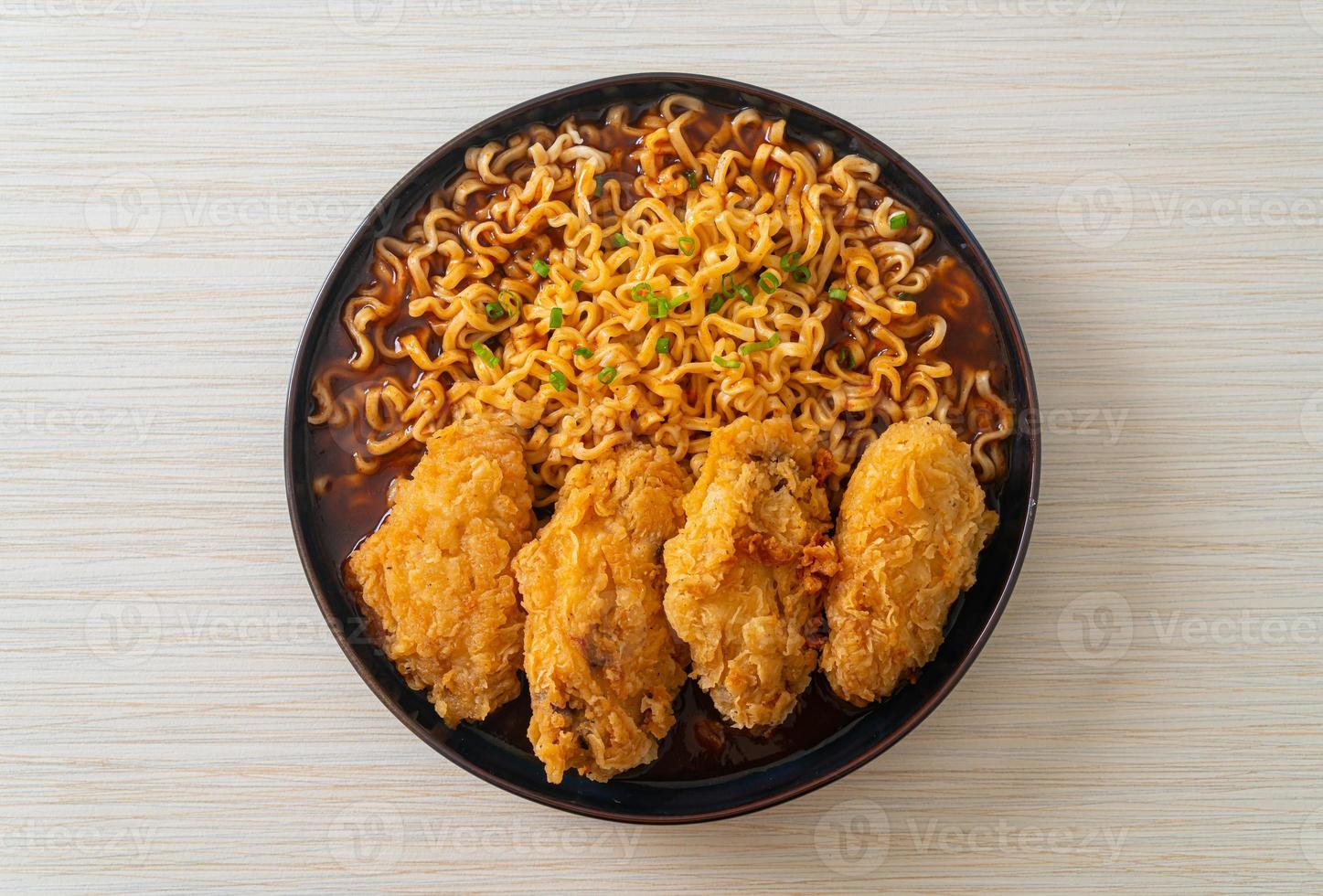 Korean instant noodles with fried chicken or Fried chicken ramyeon photo