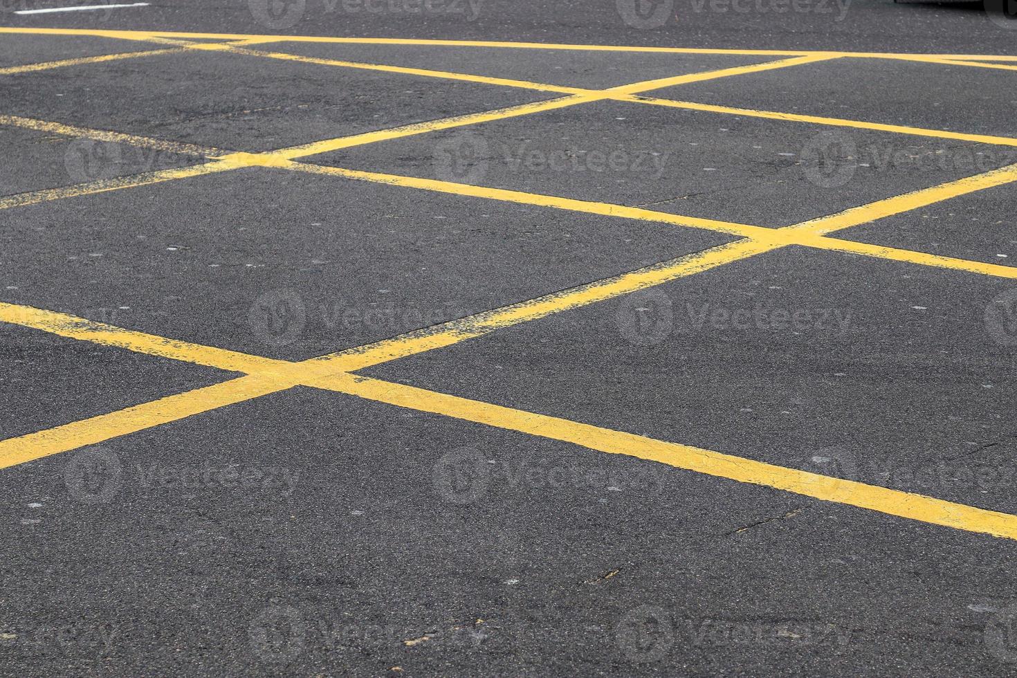 Different signs and marking painted on the ashpalt of streets and roads. photo