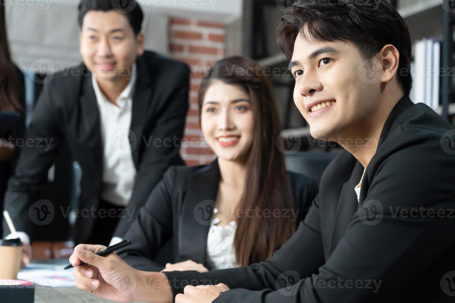 Happy group of businesspeople during presentation. Business people working as a team at the office photo