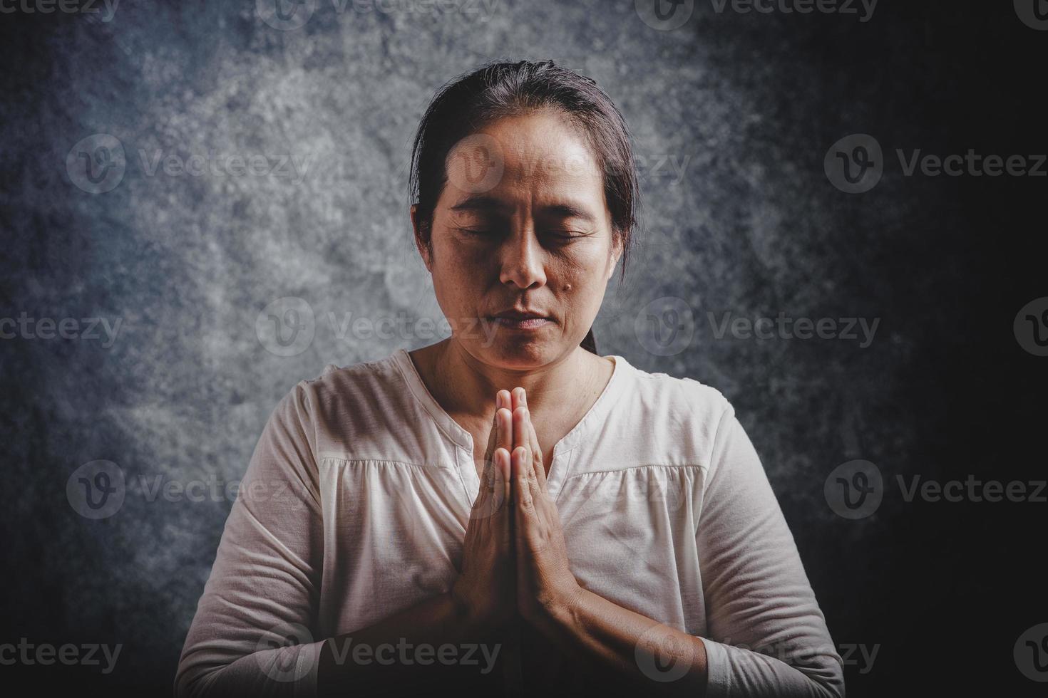 Woman Pray for god blessing to wishing have a better life photo