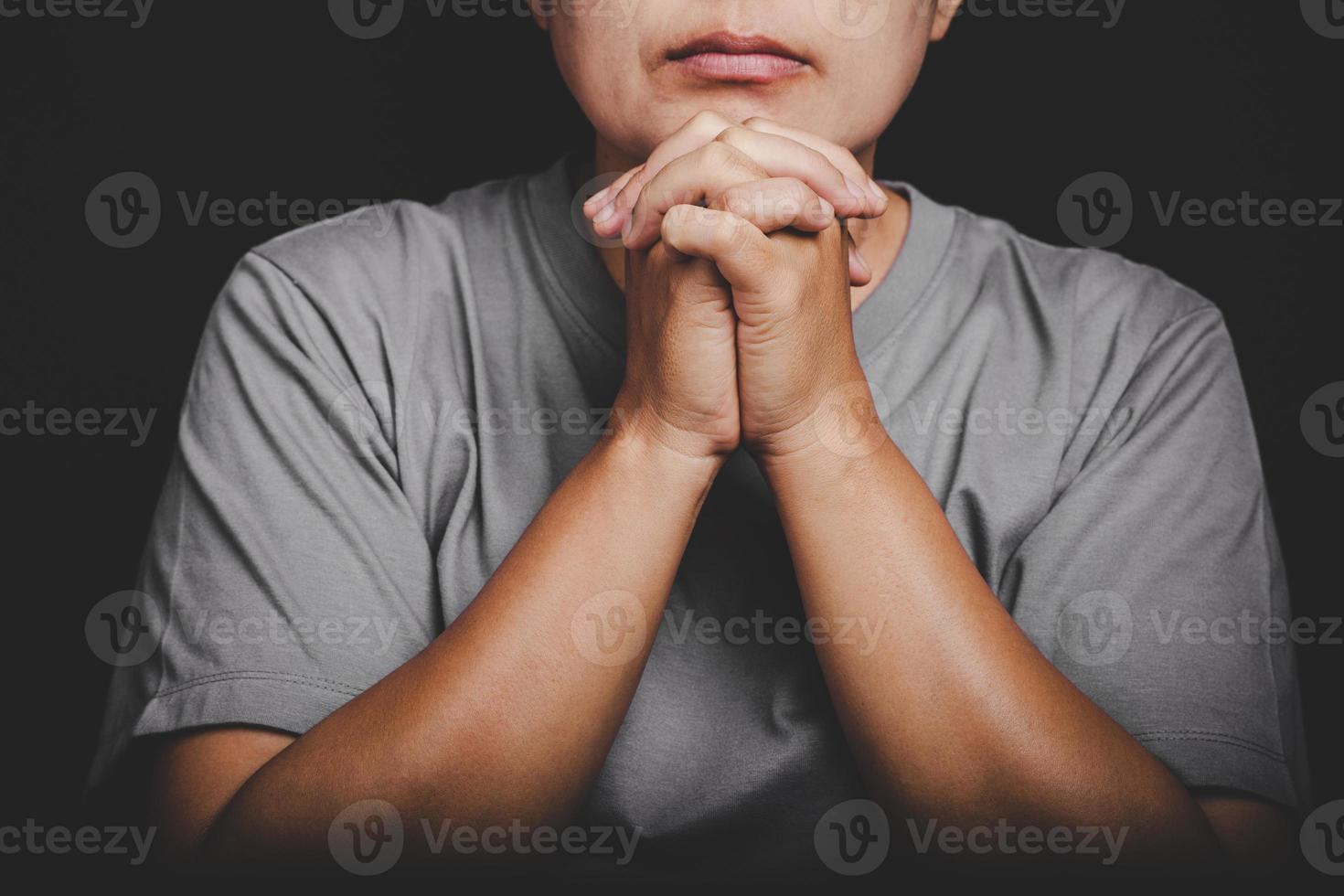 christianity woman catholic hand pray and worship in the church, Hands folded in prayer concept for faith, spirituality and religion, Hands Raised In Worship background. photo