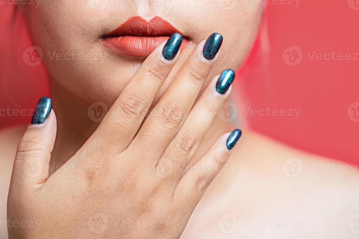 Beauty model girl with green manicure nails. Woman Fashion makeup and care for hands cosmetics. Health care. Beauty spa salon. Clean smooth skin, Nude lips. hand near the face photo