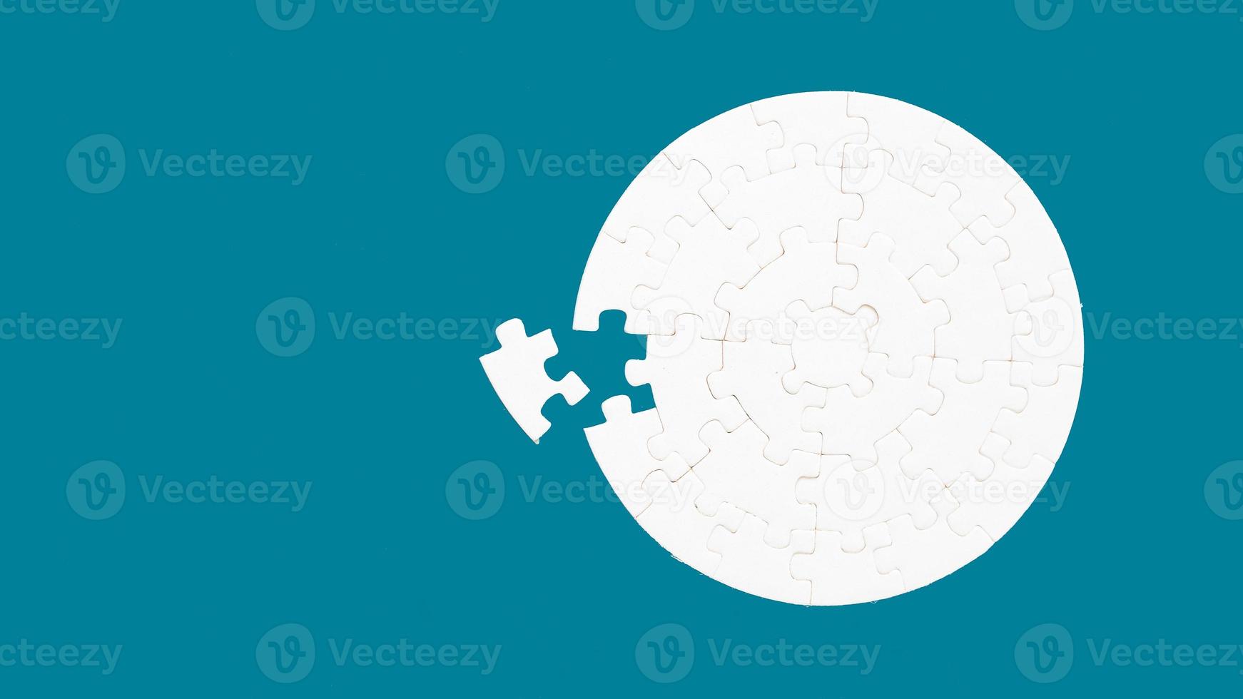 White part of jigsaw puzzle pieces on blue background. concepts of problem solving, business success, teamwork, Team playing jigsaw game incomplete, Texture photo with copy space for text