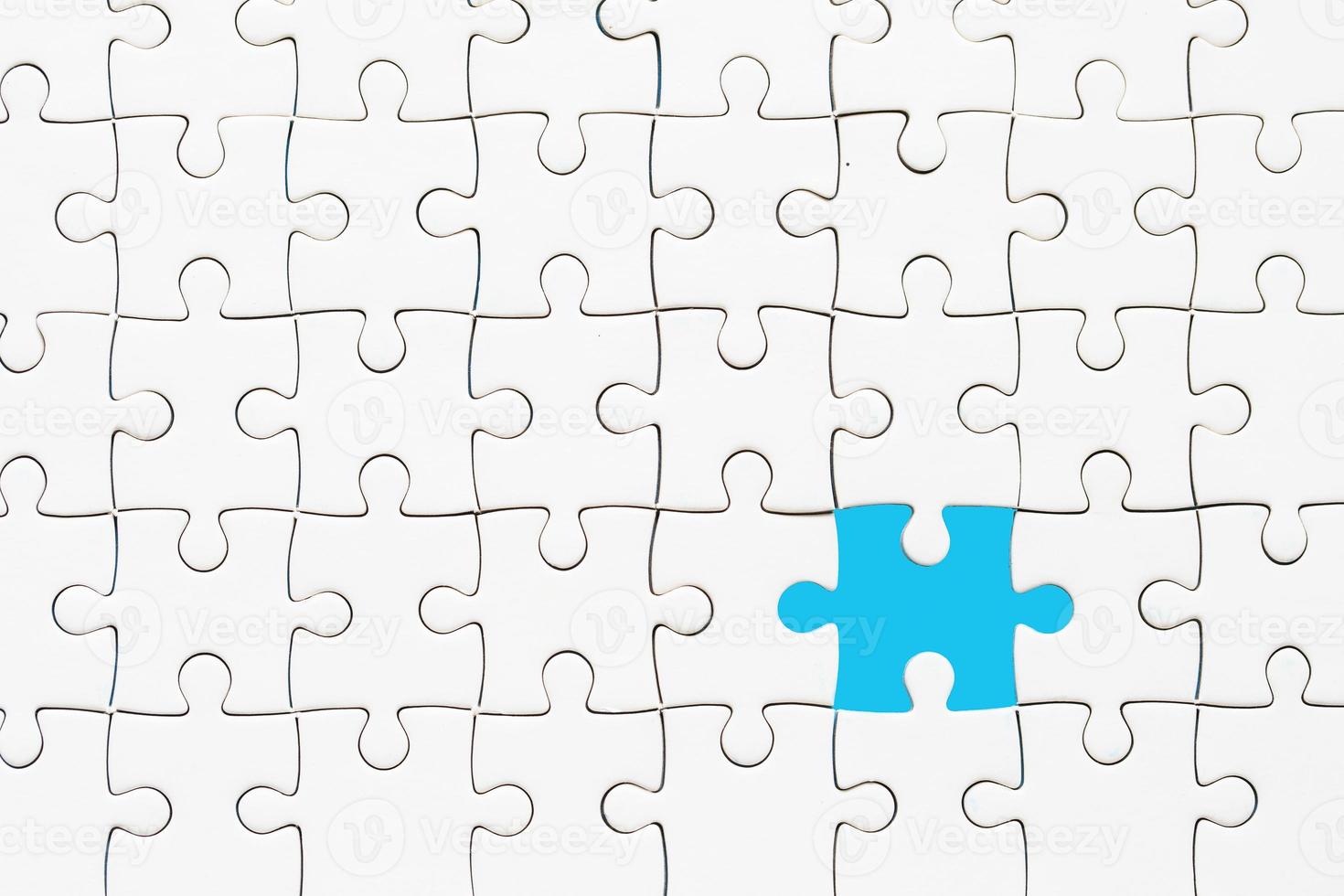 White part of jigsaw puzzle pieces on blue background. concepts of problem solving, business success, teamwork, Team playing jigsaw game incomplete, Texture photo with copy space for text