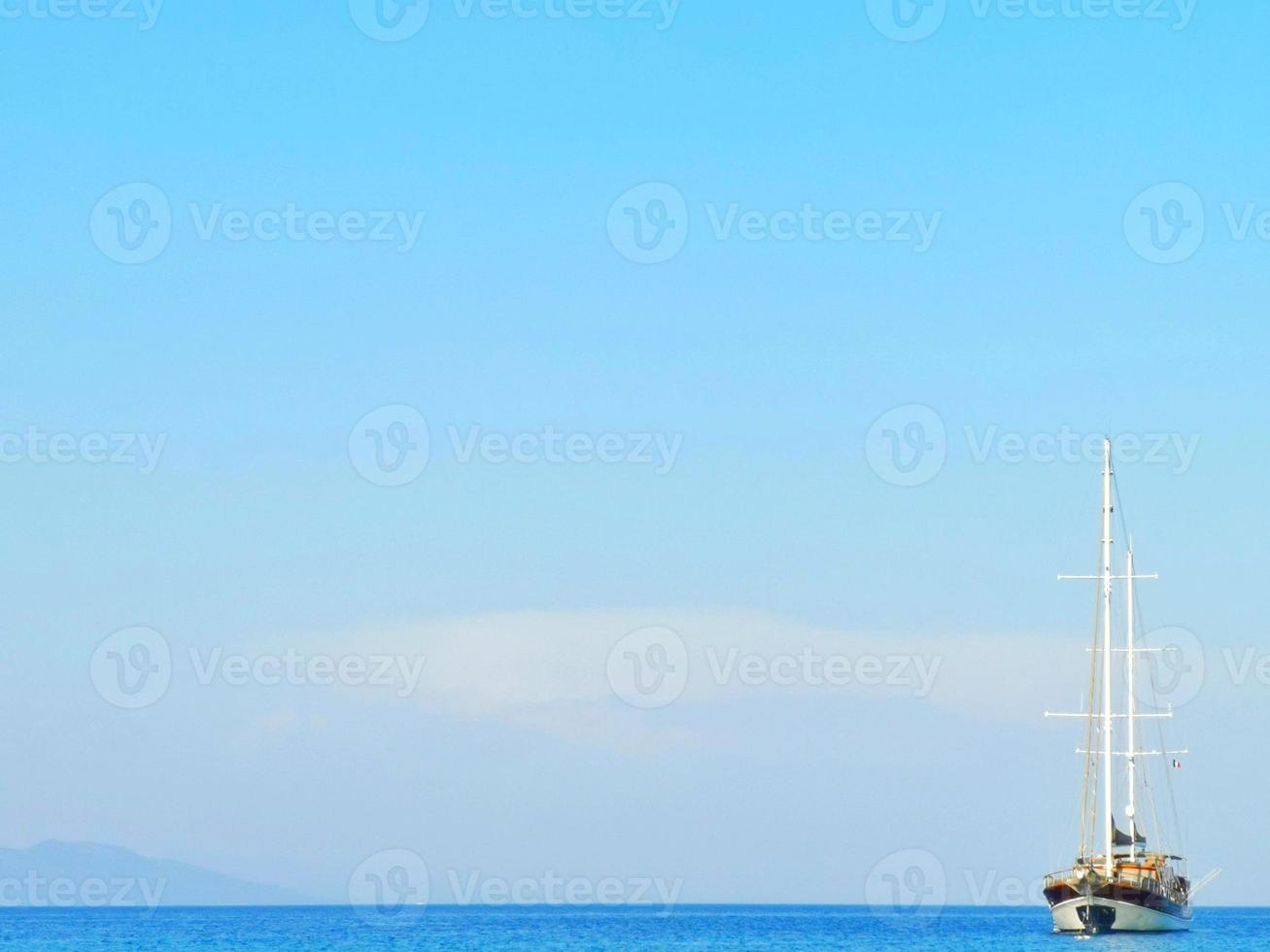 A large junk boat in the middle of the sea photo