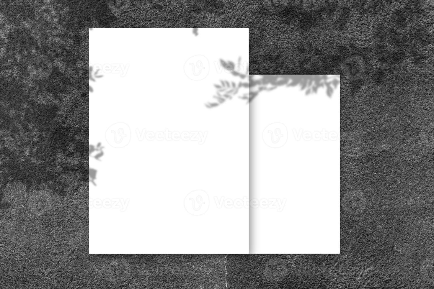 Empty white square poster mockup with light shadow on black concrete wall background. photo