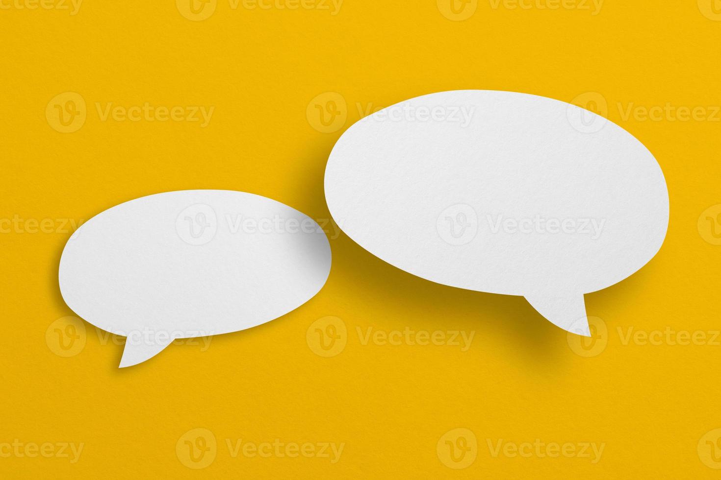 speech balloon shape white paper isolated on yellow background photo