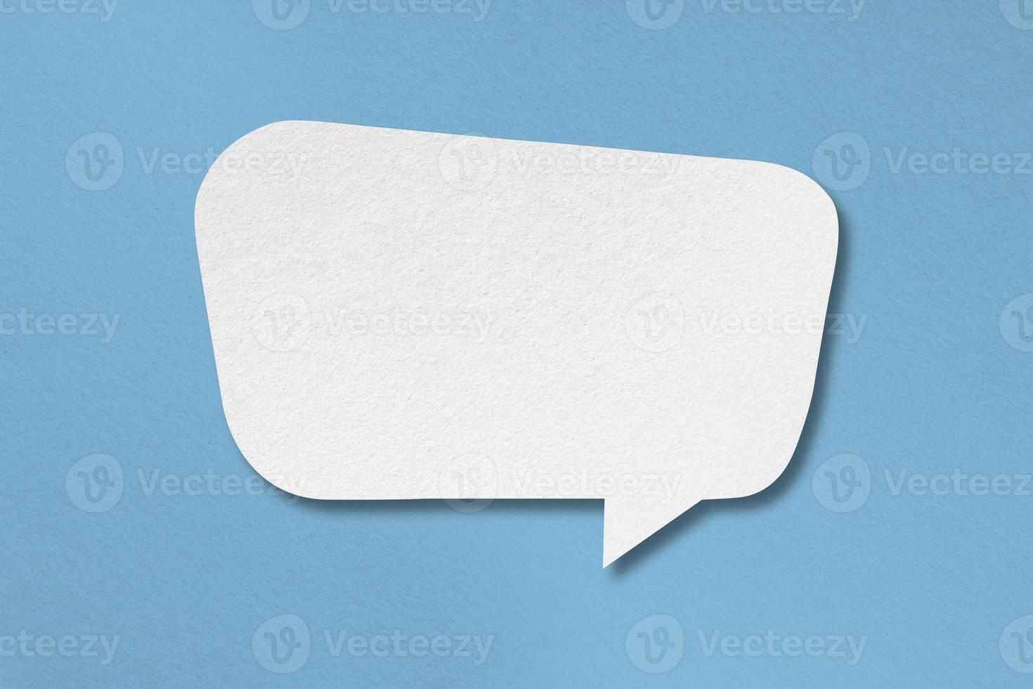 white paper with speech bubbles isolated on blue background communication bubbles photo