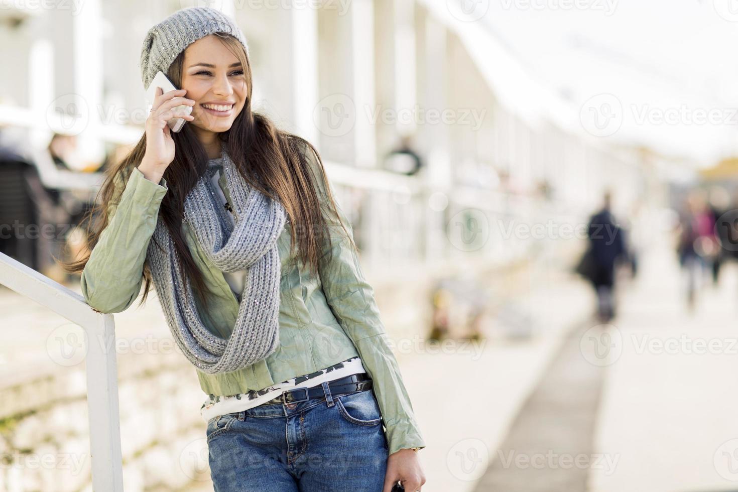 Young woman with mobile phone photo