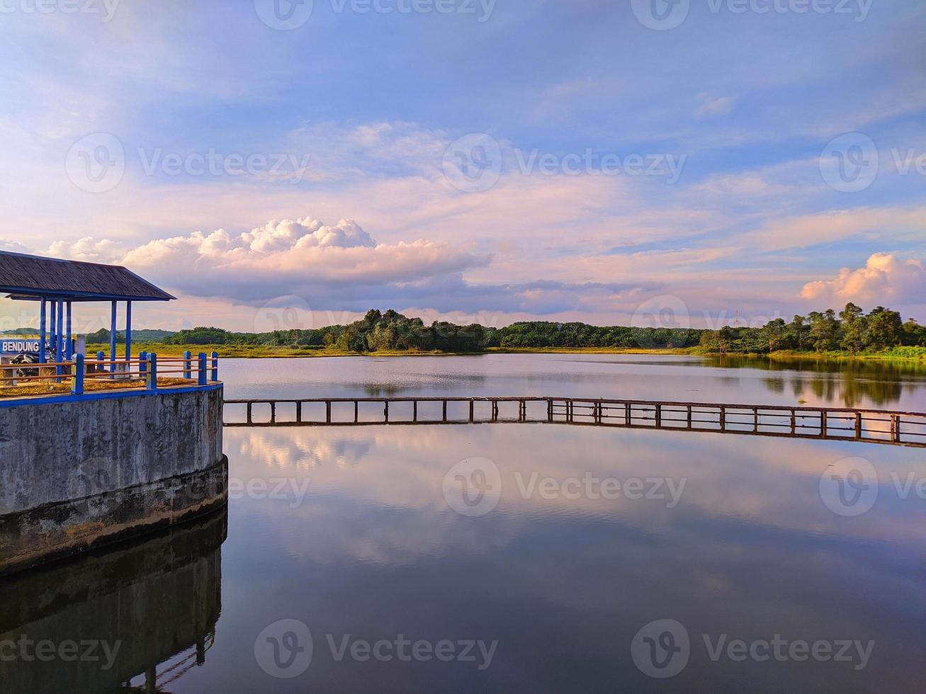 Wooden bridge over lake photo