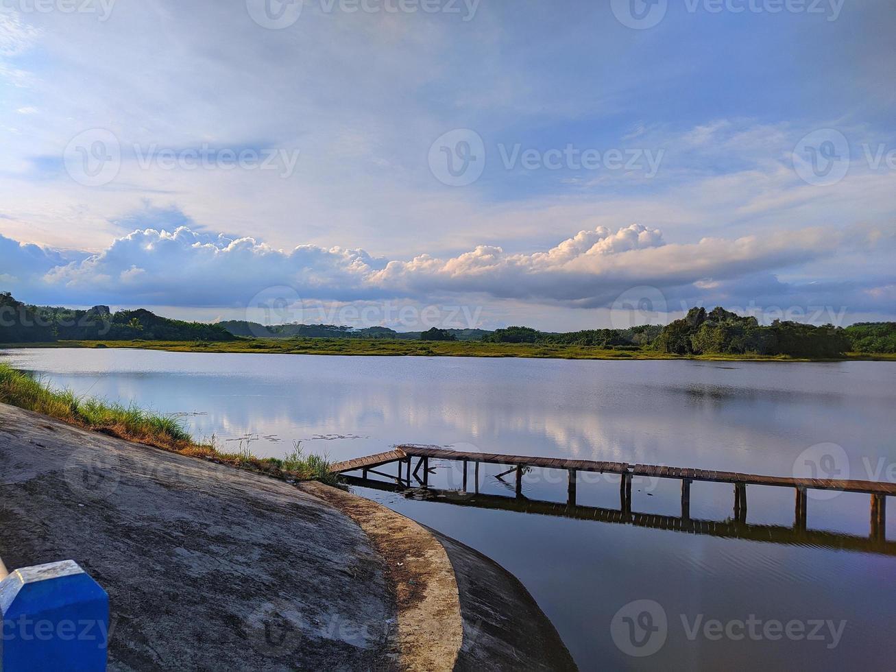 Wooden bridge over lake photo