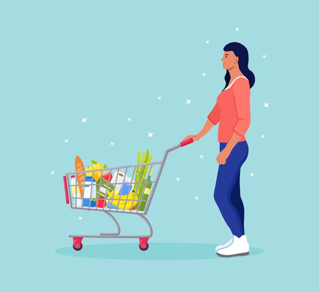 Woman pushing shopping cart full of groceries in the supermarket. There is a bread, bottles of water, milk, fruits, vegetables and other products in the basket vector