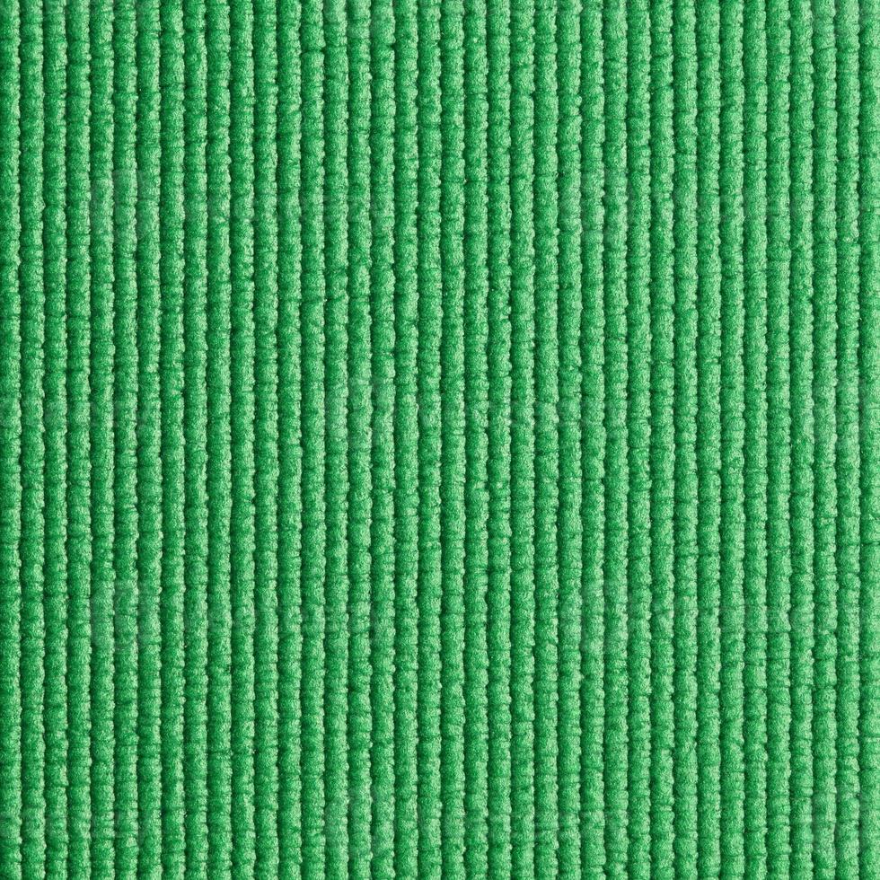 green yoga mat texture background photo