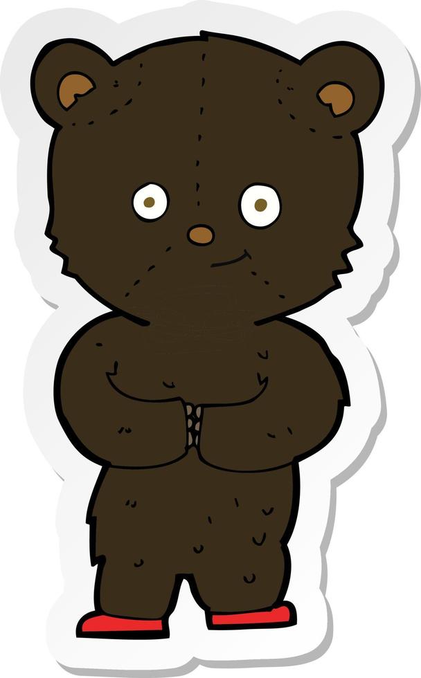 sticker of a cartoon teddy black bear cub vector