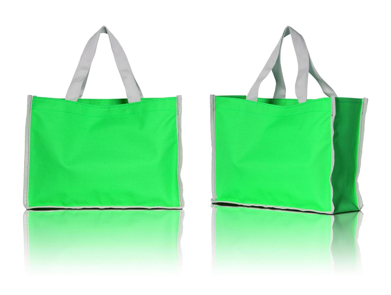 green shopping bag on white background photo